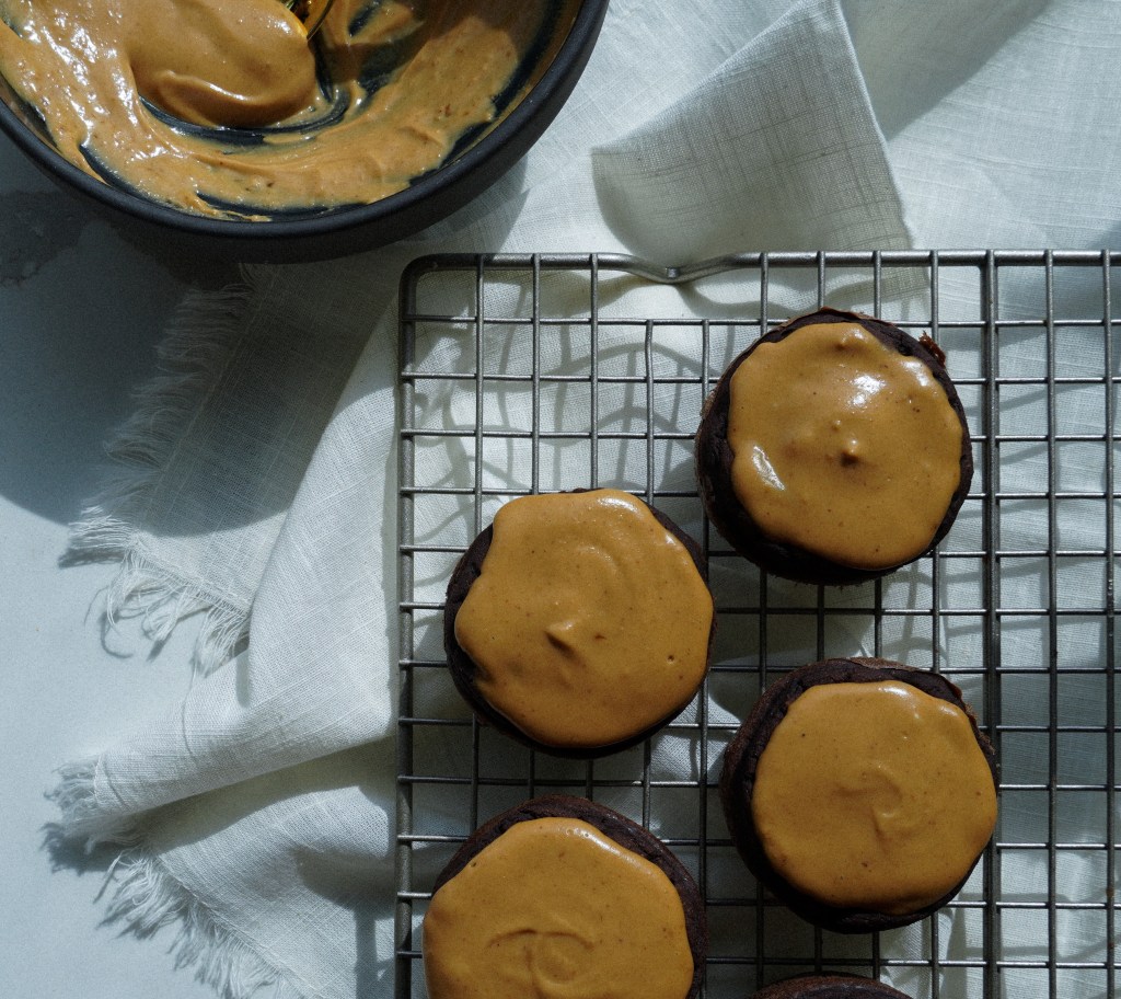 chocolate pb protein muffins on a cooling rack